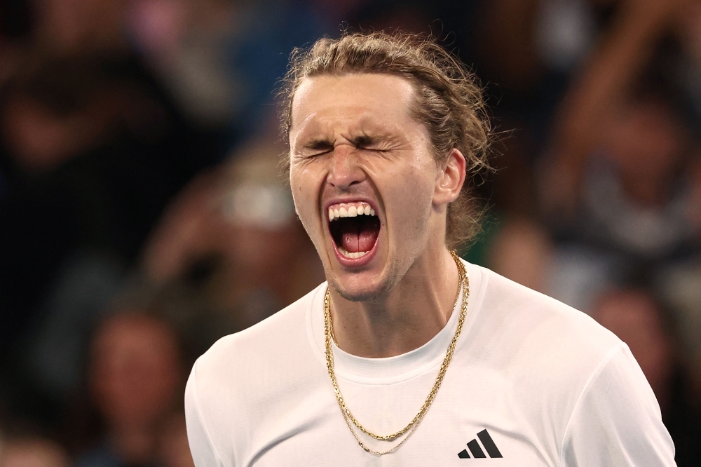 Germany's Alexander Zverev celebrates match point against Slovakia's Lukas Klein during their men's singles match on day five of the Australian Open tennis tournament in Melbourne on January 18, 2024. (Photo by David GRAY / AFP)