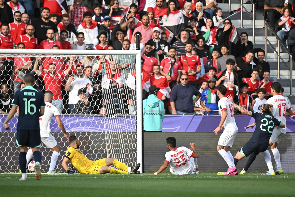 Australia’s Jackson Irvine (second right) scores a goal against Syria. AFP