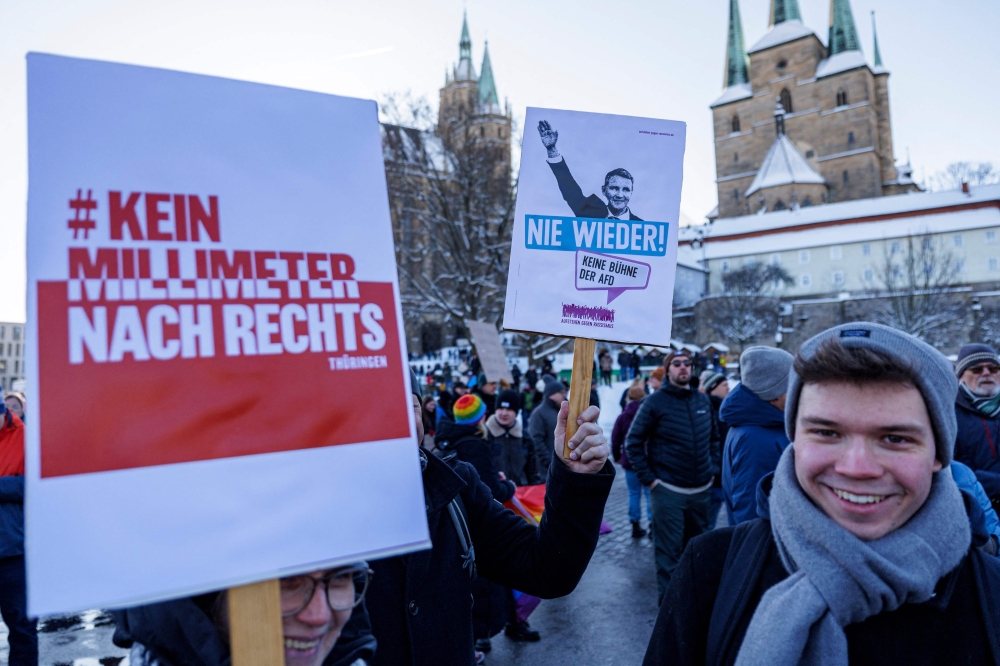 People take part in a demonstration against racism and far right politics, in Erfurt, eastern Germany on January 20, 2024. (Photo by JENS SCHLUETER / AFP)
