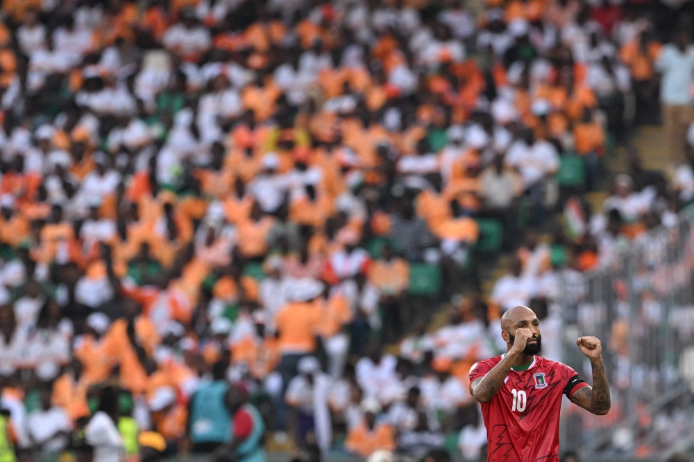 Equatorial Guinea's forward #10 Emilio Nsue celebrates scoring his team's first goal during the Africa Cup of Nations (CAN) 2024 group A football match between Equatorial Guinea and Ivory Coast at the Alassane Ouattara Olympic Stadium in Ebimpe, Abidjan on January 22, 2024. (Photo by Issouf SANOGO / AFP)
