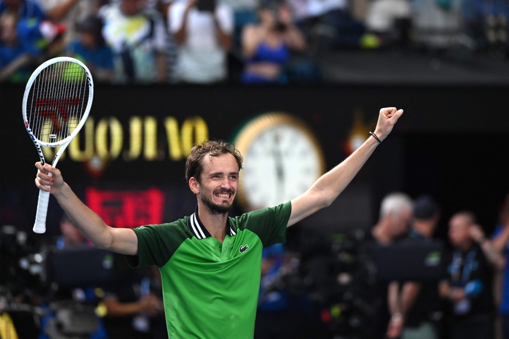 Russia's Daniil Medvedev celebrates victory against Poland's Hubert Hurkacz during their men's singles quarter-final match on day 11 of the Australian Open tennis tournament in Melbourne on January 24, 2024. (Photo by Paul Crock / AFP)