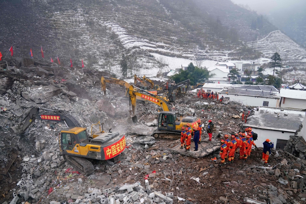 Rescue workers search for missing victims at a landslide site in southwestern China's Yunnan province on January 23, 2024. (Photo by CNS / AFP) 