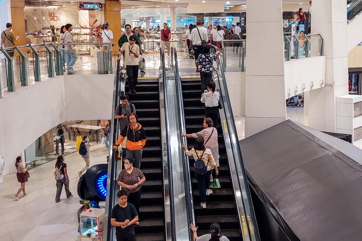 People are seen inside a shopping mall in Quezon City, the Philippines, Jan. 12, 2024. Xinhua/Rouelle Umali