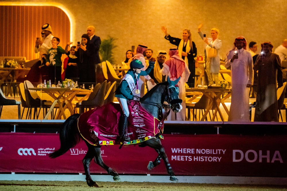 Saudi Arabia's Abdullah Alsharbatly celebrates astride Alamo after winning the CS15* - 1.60m Grand Prix title.