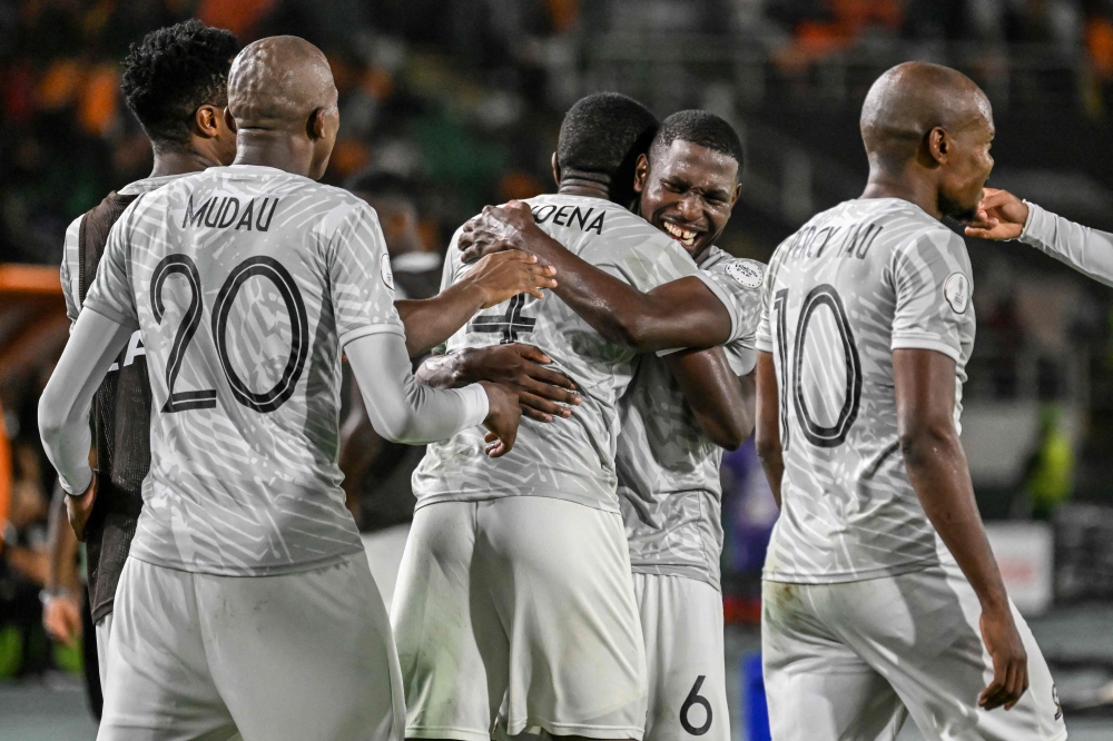 South Africa's players celebrate after winning the Africa Cup of Nations (CAN) 2024 round of 16 football match between Morocco and South Africa at the Stade Laurent Pokou in San Pedro on January 30, 2024. (Photo by SIA KAMBOU / AFP)
