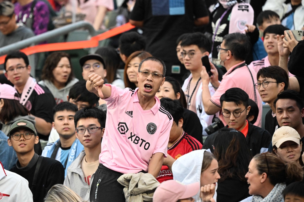 Fans react after not seeing Inter Miami's Argentine forward Lionel Messi play on February 4, 2024. (Photo by Peter Parks / AFP)