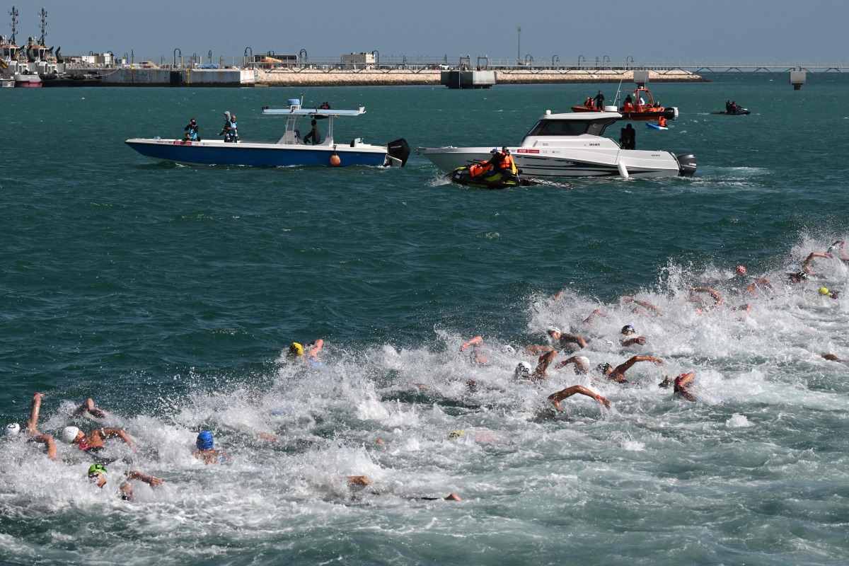 Swimmers compete in the final of the men’s 10km open water swimming event. AFP