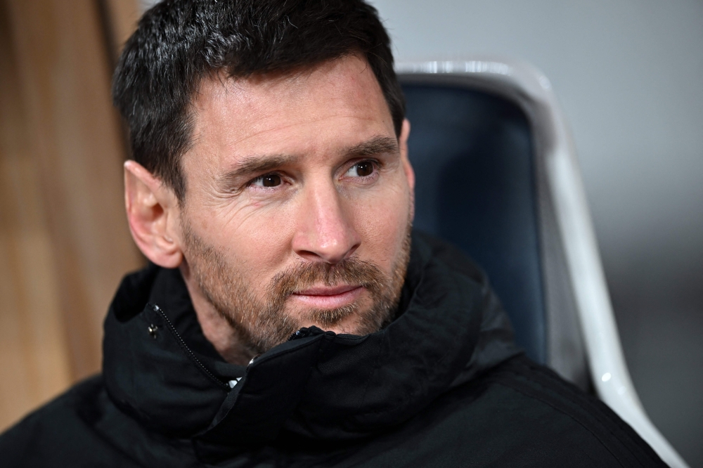 Inter Miami's Argentine forward Lionel Messi sits on the bench before the start of the friendly football match between Inter Miami of the US's Major League Soccer league and Vissel Kobe of Japan's J-League at the National Stadium in Tokyo on February 7, 2024. (Photo by Philip FONG / AFP)
