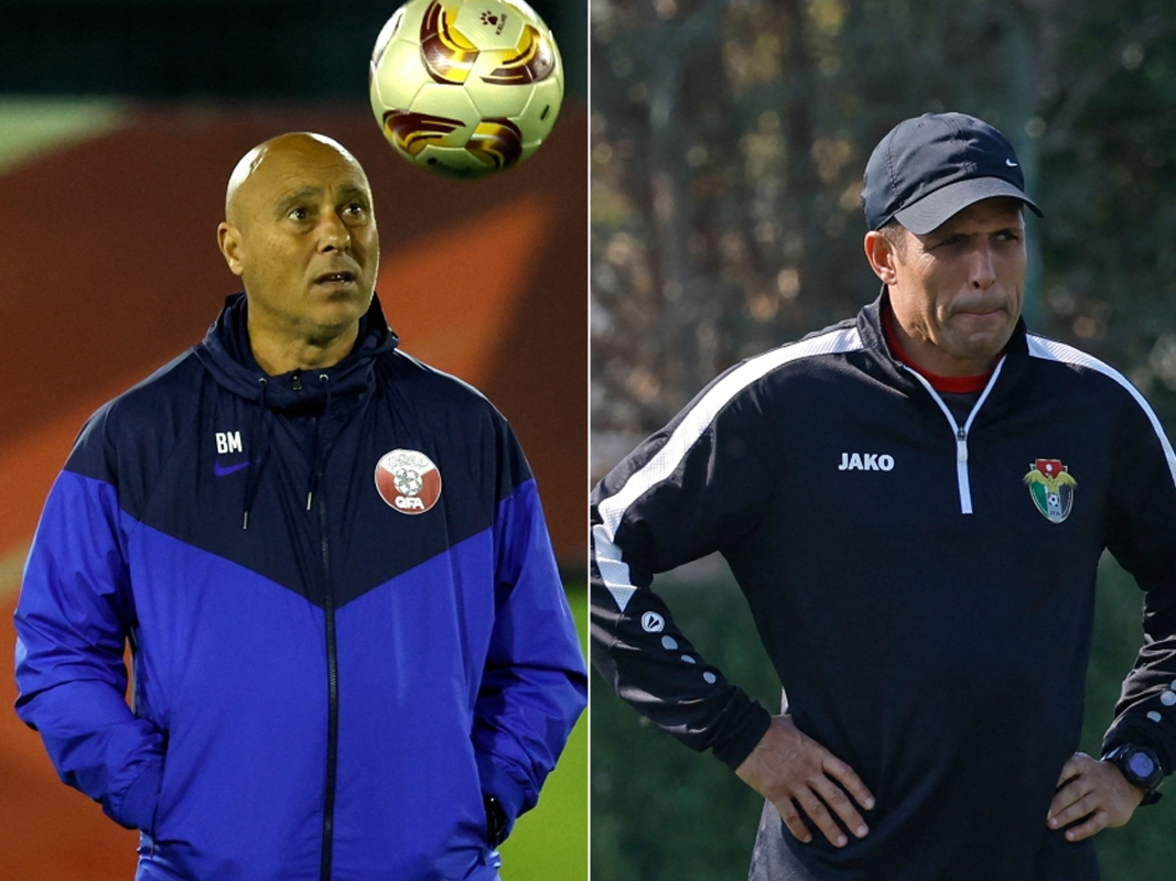 Qatar's Spanish coach Tintin Marquez and Jordan's Moroccan coach Hussein ammouta  attend their team's training session in Doha on February 9, 2024, on the eve of their AFC Qatar 2023 Asian Cup final football match. (Photos by KARIM JAAFAR / AFP)