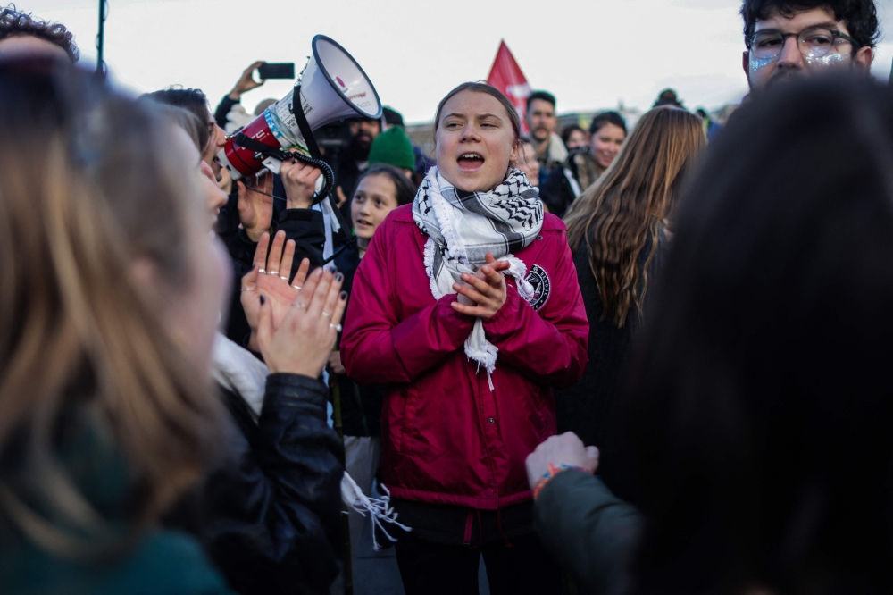 Swedish environmental activist Greta Thunberg takes part in a demonstration in Bordeaux, southwestern France, on February 11, 2024, against plans to drill eight new oil wells in La Teste-de-Buch forest. (Photo by Thibaud Moritz / AFP)