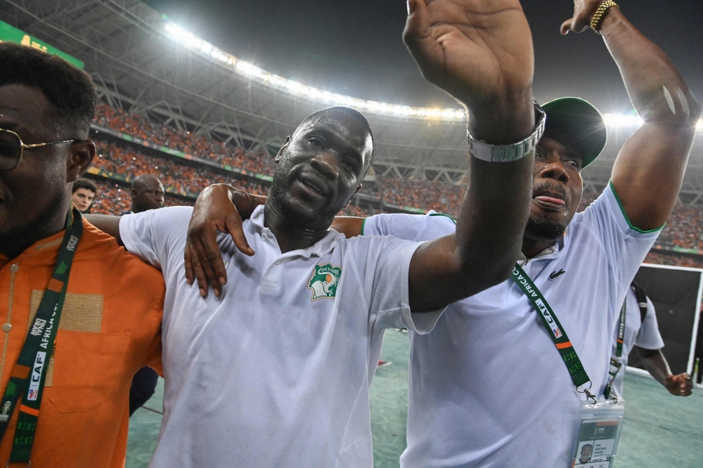 Ivory Coast's French coach Emerse Fae (C) celebrates after his team won the Africa Cup of Nations (CAN) 2024 final football match in Ebimpe, Abidjan on February 11, 2024. (Photo by Issouf Sanogo / AFP)