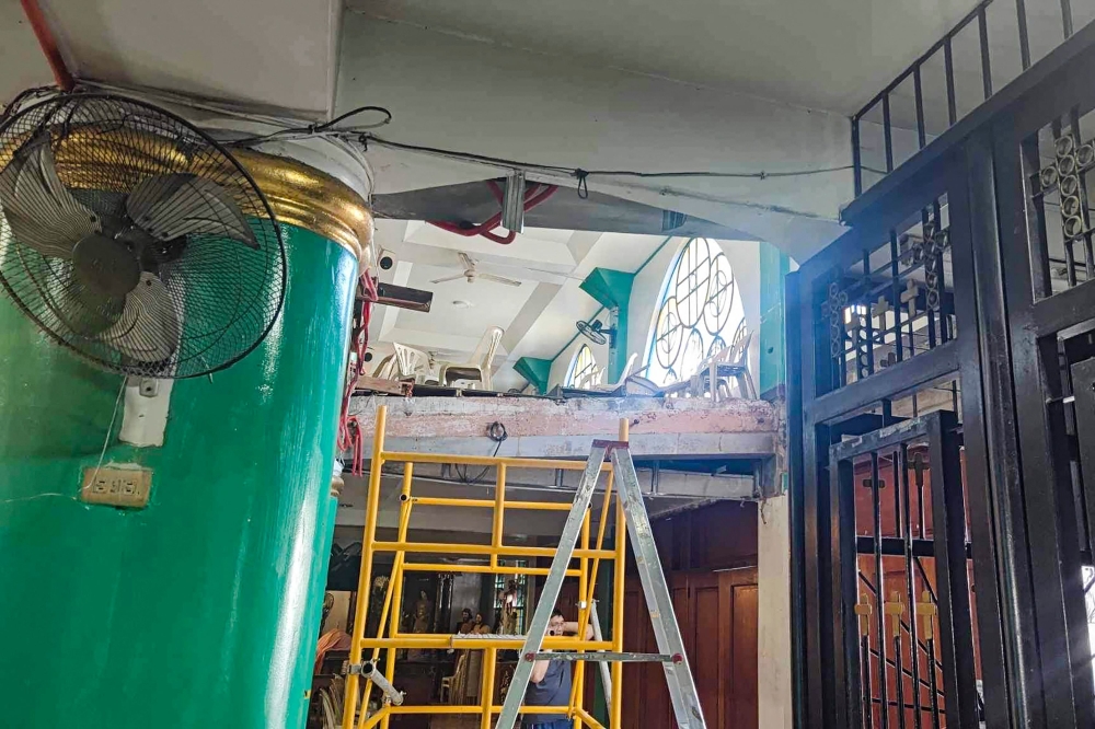 This photo shows a general view of a partially collapsed balcony inside a church in San Jose del Monte, Bulacan, on February 14, 2024. Photo by Neil Nuٌez / AFP