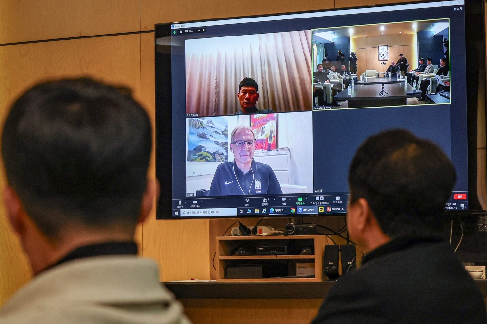 South Korean national team head coach Jurgen Klinsmann (on screen) attends via a video conference during a meeting of the national team committee of the Korea Football Association (KFA) at the KFA headquarters in Seoul on February 15, 2024. (Photo by KOREA POOL / AFP)