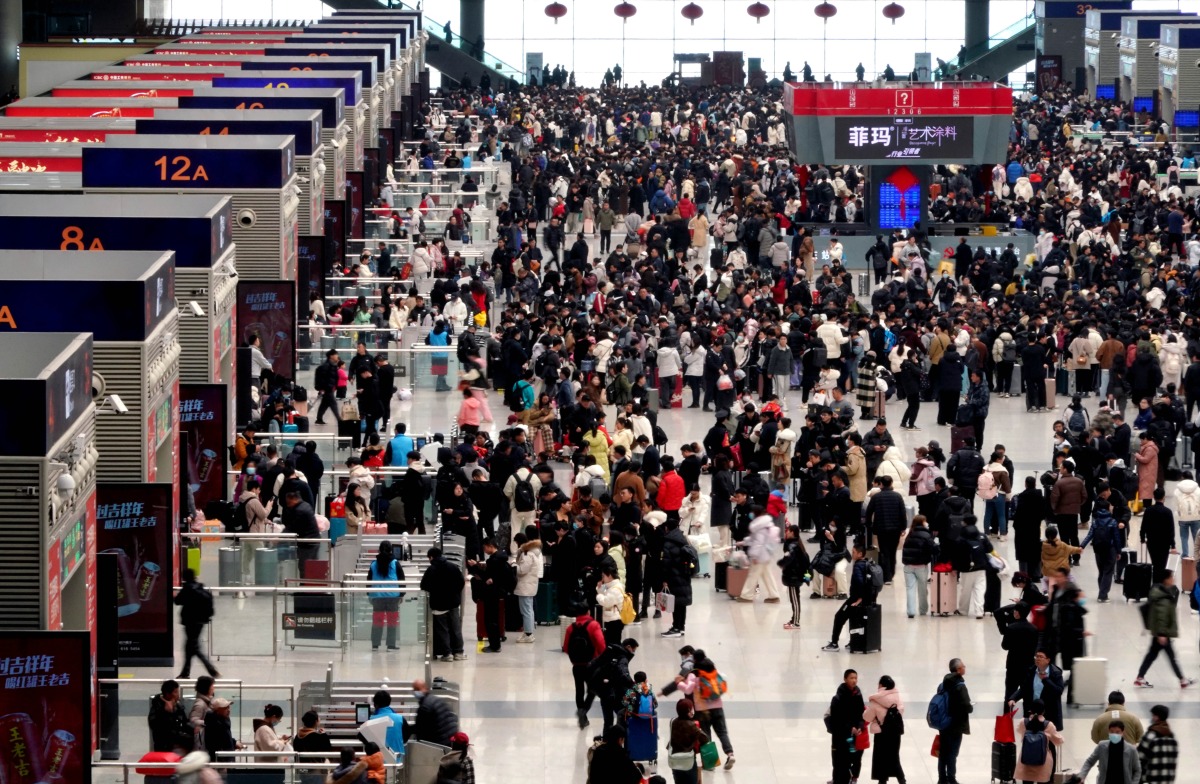 Passengers are pictured at the waiting hall of Zhengzhou East Railway Station in Zhengzhou, central China's Henan Province, Feb. 17, 2024. Xinhua/Li An