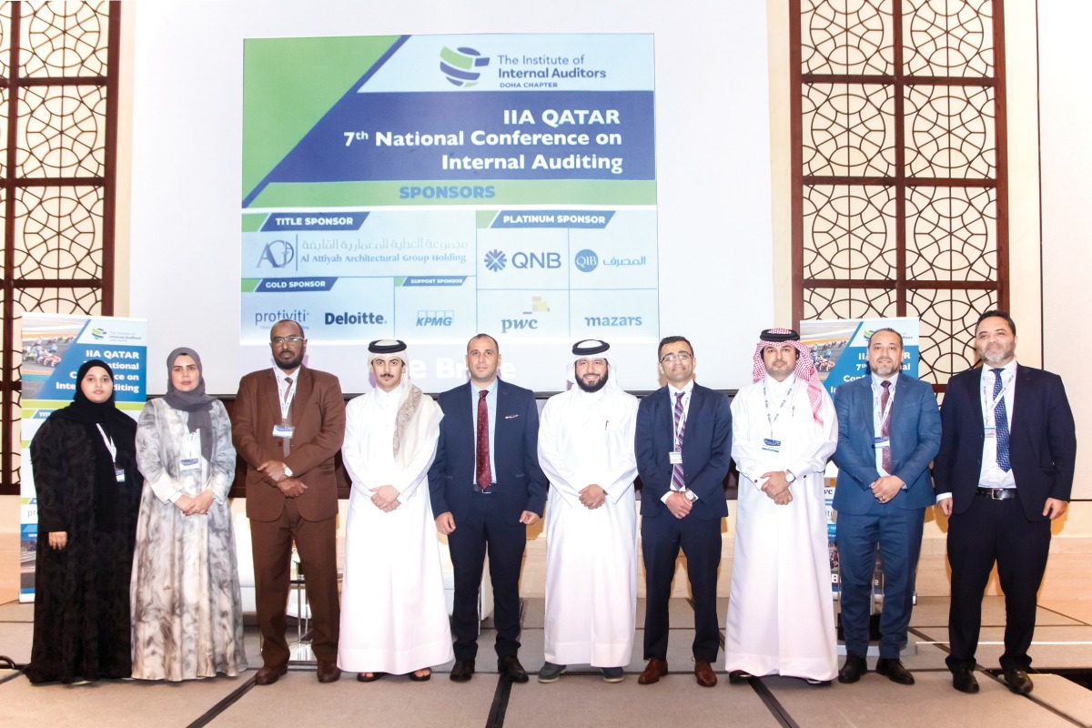 QIB’s Internal Audit team with President of IIA Qatar, Adel Mohamed Al Hashmi.