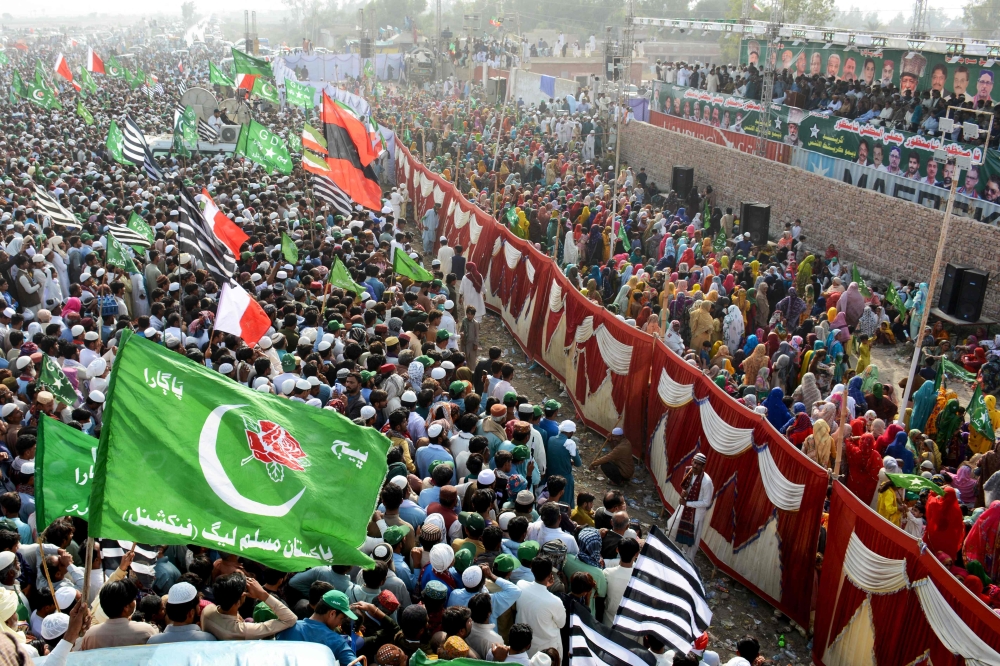 Supporters of the Grand Democratic Alliance (GDA) party protest against the alleged skewing in Pakistan's general election results, at a national highway in Moro, Sindh province on February 20, 2024. (Photo by Shahid ALI / AFP)
