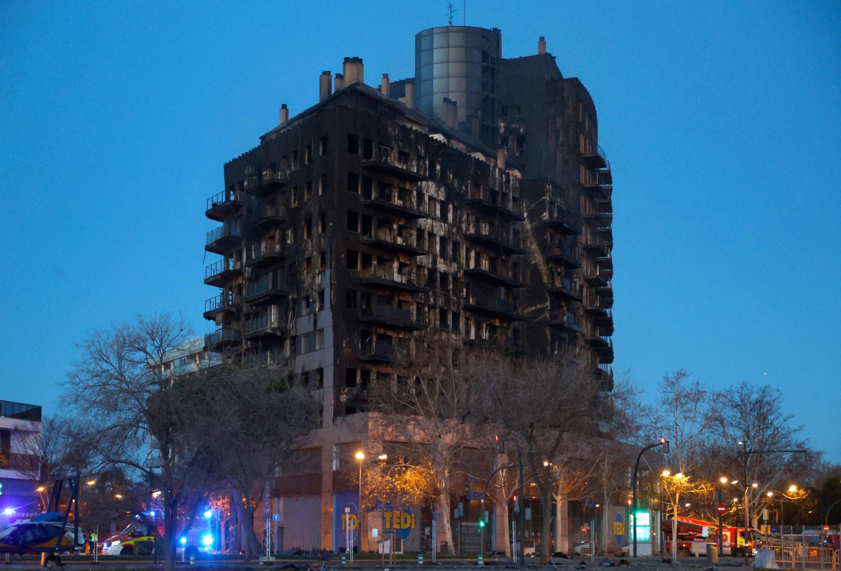 The aftermath of a huge fire that raged through a multistorey residential block killing at least four people, in Valencia in eastern Spain, on February 23, 2024. (Photo by JOSE JORDAN / AFP)