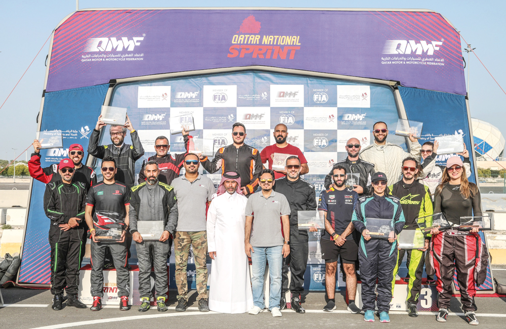 The podium winners of the second round of Qatar National Sprint pose for a photograph with officials.