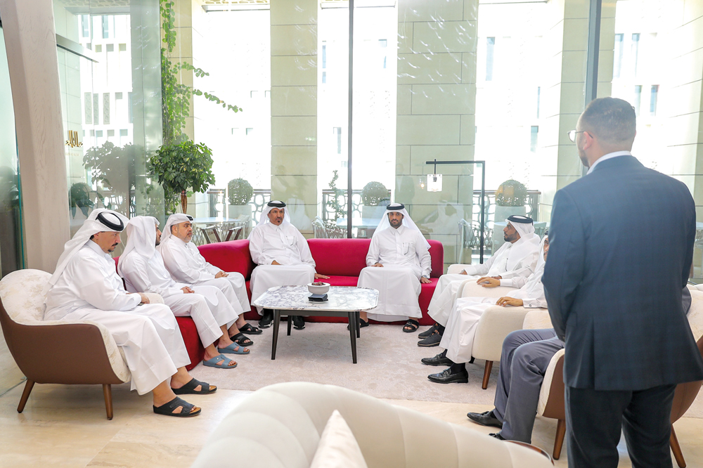 QC First Vice-Chairman Mohamed bin Ahmed bin Twar Al Kuwari listens to an explanation about the club