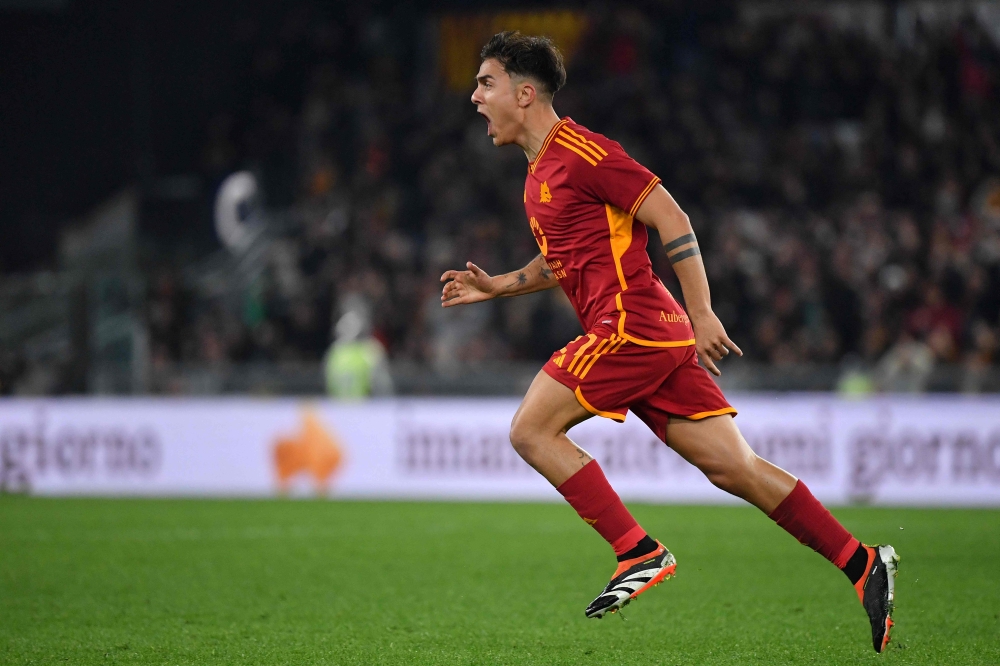 Roma's Argentine forward #21 Paulo Dybala celebrates after scoring the team second goal during the Italian Serie A football match between AS Roma and Torino on February 26, 2024 at the Olympic stadium in Rome. (Photo by Tiziana FABI / AFP)
