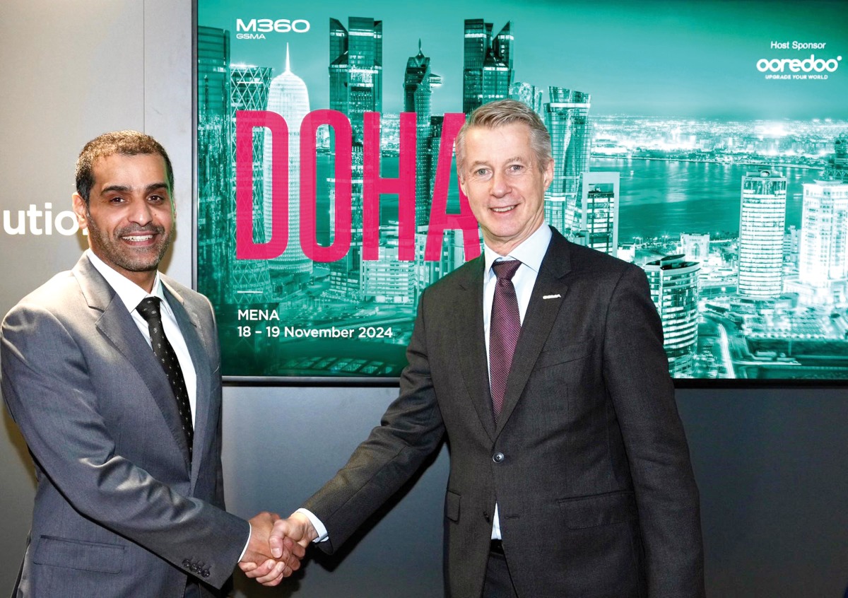 Ooredoo and GSMA officials during the signing ceremony.