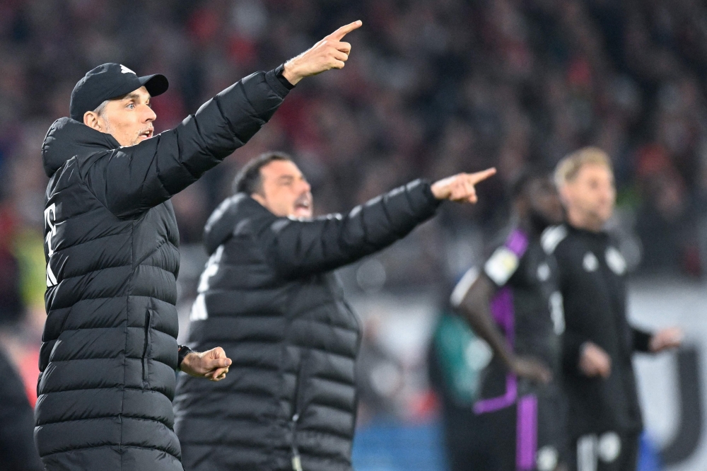 Bayern Munich's German head coach Thomas Tuchel (L) reacts from the sidelines the German first division Bundesliga football match SC Freiburg v FC Bayern Munich in Freiburg, southwestern Germany on March 1, 2024. (Photo by THOMAS KIENZLE / AFP)