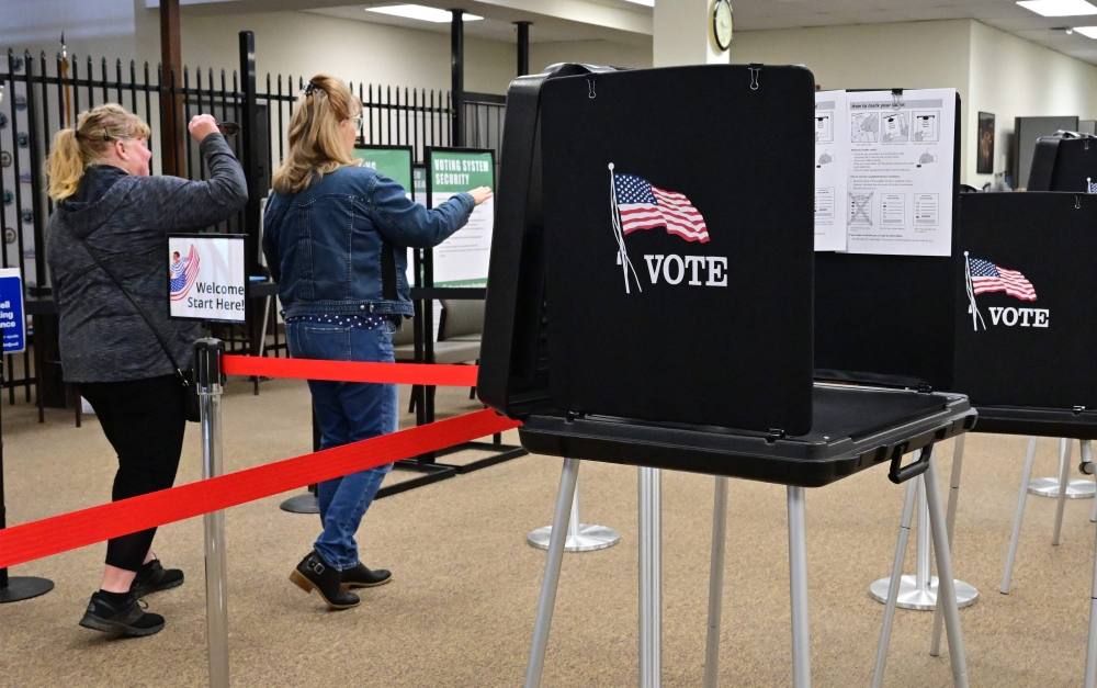 People arrive to cast their ballots at the Shasta County Clerk & Registrar of Voters offices on February 23, 2024 in Redding in Northern Califonia's Shasta County.  (Photo by Frederic J. BROWN / AFP)
