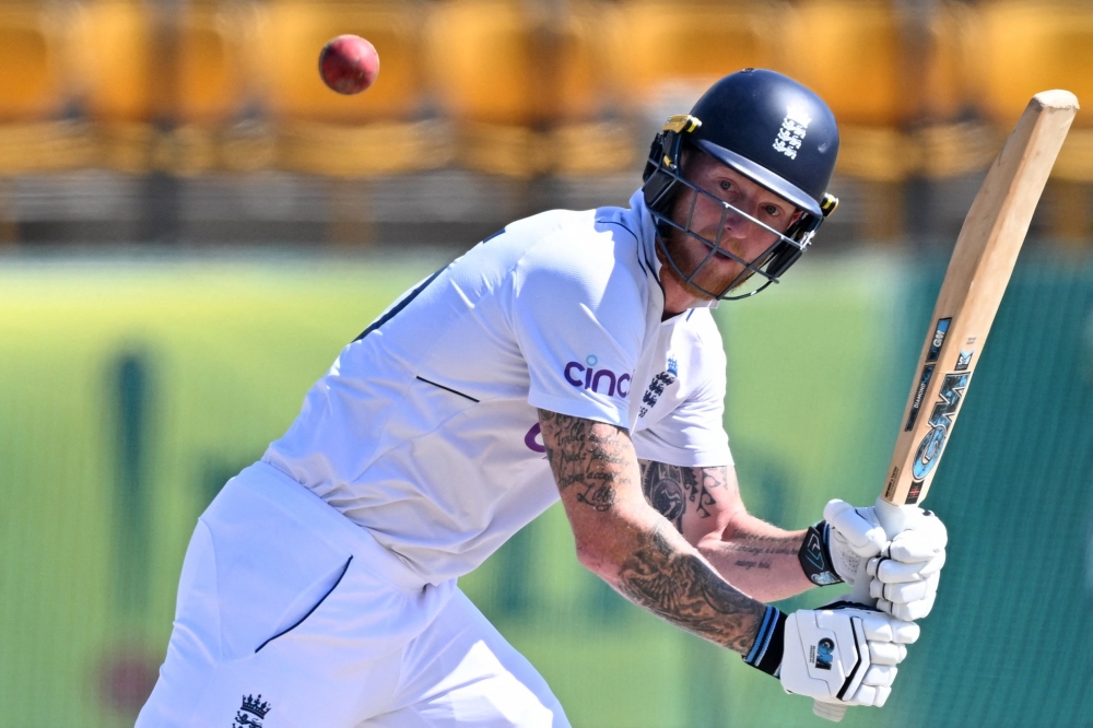 England's captain Ben Stokes watches the ball after playing a shot during the third day of the fifth and last Test cricket match between India and England at the Himachal Pradesh Cricket Association Stadium in Dharamsala on March 9, 2024. (Photo by Sajjad Hussain / AFP)