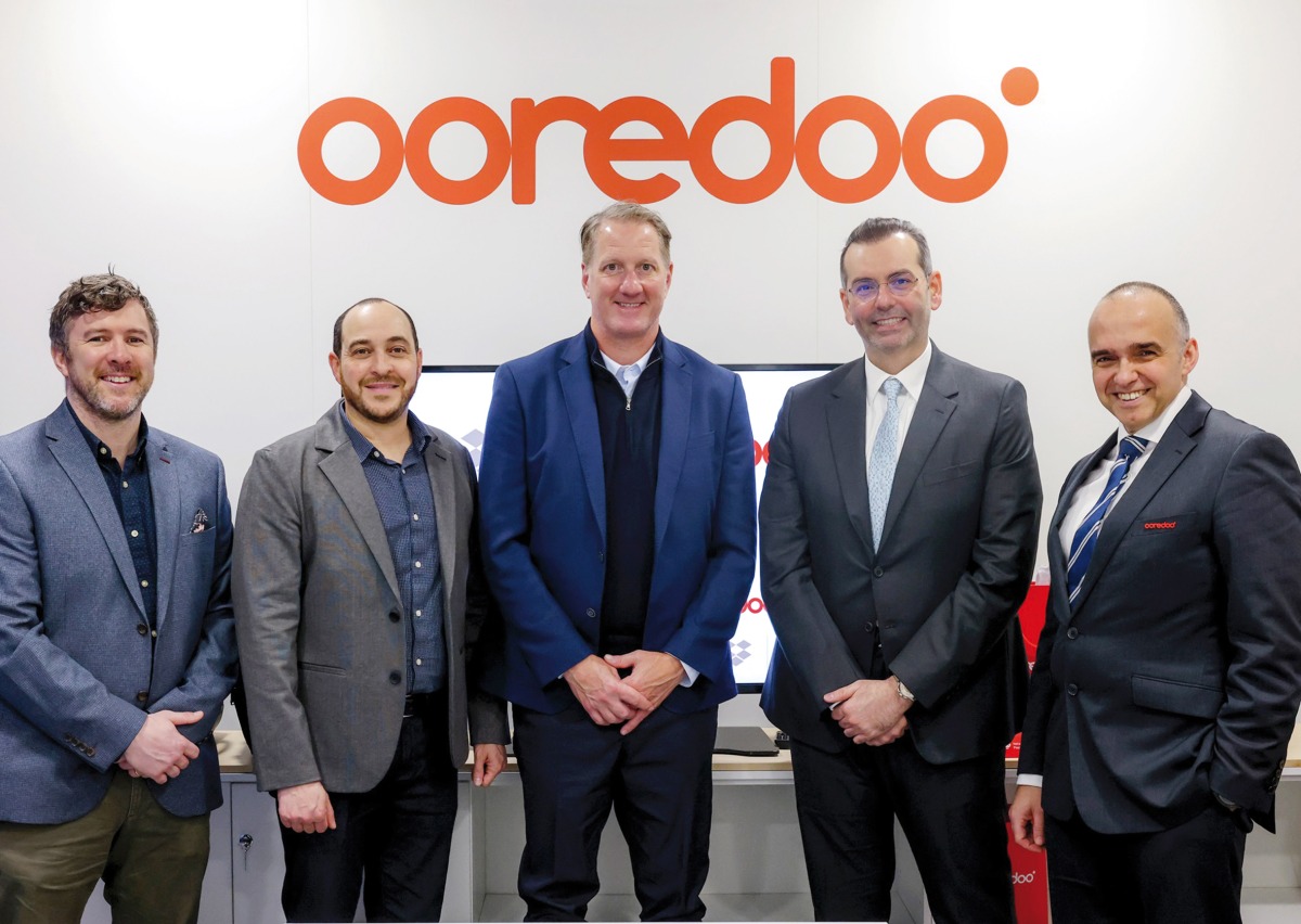 Ooredoo Group and Dropbox officials during the partnership signing.