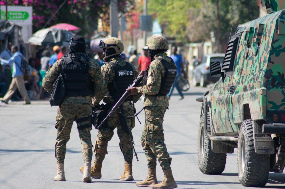 Haitian police officers deploy in Port-au-Prince, Haiti, on March 9, 2024. Sporadic gunfire rang out in Port-au-Prince late March 8, an AFP correspondent there heard, as residents desperately sought shelter amid the recent explosion of gang violence in the Haitian capital. (Photo by Clarens SIFFROY / AFP)
