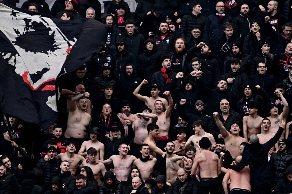 Milan fans cheer during the Italian Serie A football match between AC Milan and Empoli at San Siro stadium in Milan, on March 10, 2024. (Photo by GABRIEL BOUYS / AFP)
