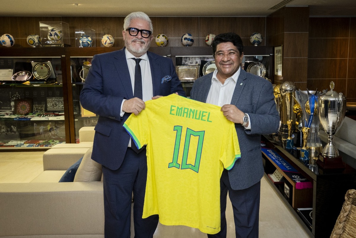 Brazilian Football Confederation President Ednaldo Rodrigues (right) presents a jersey to Sport Integrity Global Alliance SIGA CEO Emanuel Macedo de Medeiros.