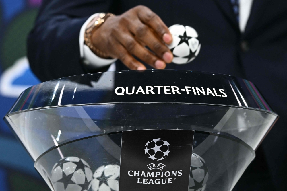 Former Nigerian footballer John Obi Mikel performs the 2023-2024 UEFA Champions League football tournament quarter-finals and semi-finals draw at the House of European Football in Nyon, on March 15, 2024. (Photo by Fabrice COFFRINI / AFP)
