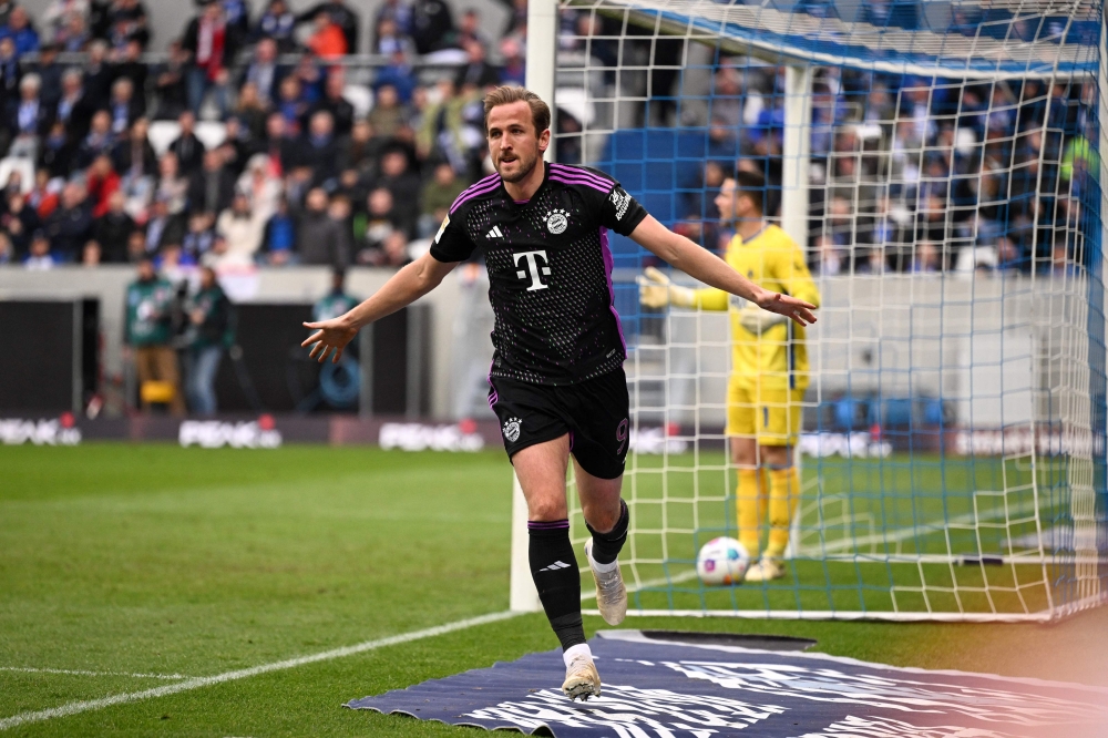 Bayern Munich's English forward #09 Harry Kane celebrates scoring during the German first division Bundesliga football match between SV Darmstadt 98 and FC Bayern Munich in Darmstadt, western Germany on March 16, 2024. (Photo by Kirill KUDRYAVTSEV / AFP)