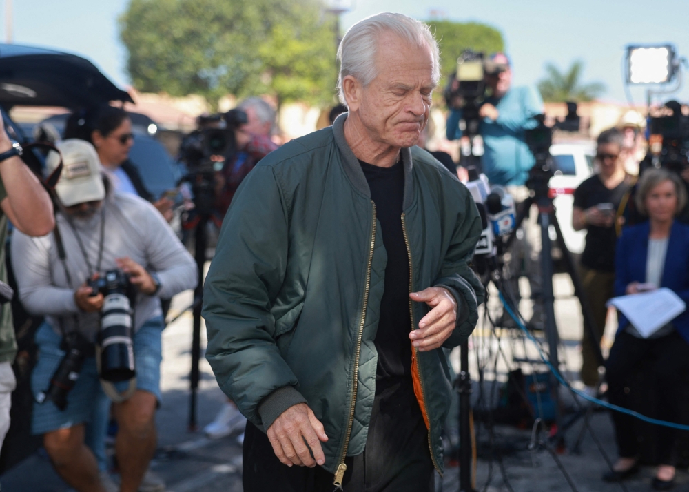 Former Donald Trump adviser Peter Navarro walks away after holding a press conference before turning himself into a federal prison on March 19, 2024, in Miami, Florida. (Photo by JOE RAEDLE / GETTY IMAGES NORTH AMERICA / Getty Images via AFP)
