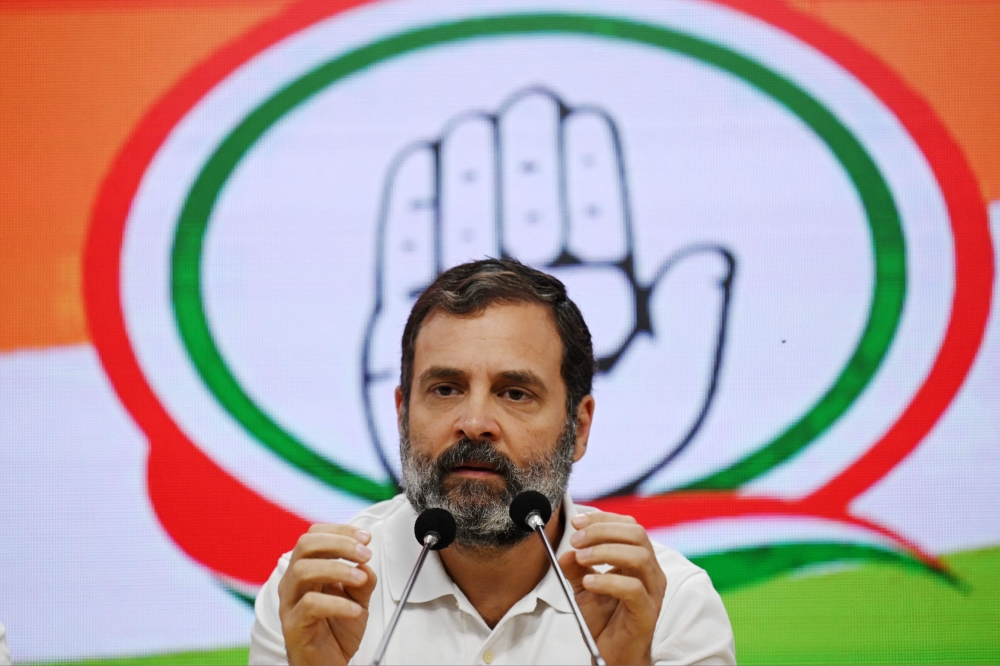 India's Congress party leader Rahul Gandhi speaks during a press conference in New Delhi on March 25, 2023, after being disqualified as a member of parliament. (Photo by Money Sharma / AFP)
