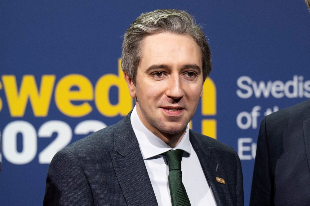 (Files) Ireland's Minister for Justice Simon Harris poses for a photograph as he arrives for the first informal ministerial meeting in Stockholm, Sweden, on January 26, 2023. (Photo by Pontus Lundahl / TT News Agency / AFP)