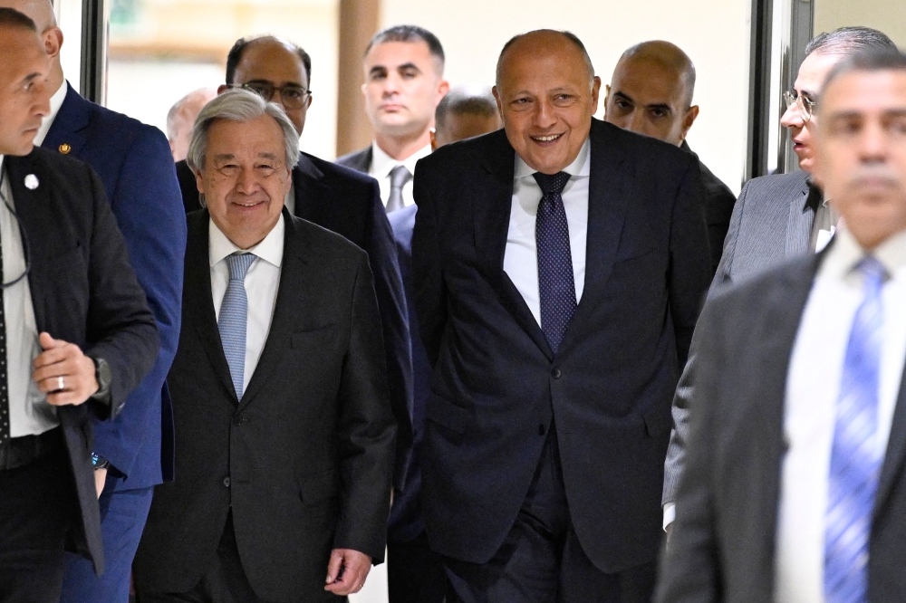 United Nations Secretary-General Antonio Guterres (L) and Egypt's Foreign Minister Sameh Shoukry, leave the room after giving a joint press conference following their meeting at the New Administrative Capital east of Cairo on March 24, 2024. (Photo by Khaled Desouki / AFP)