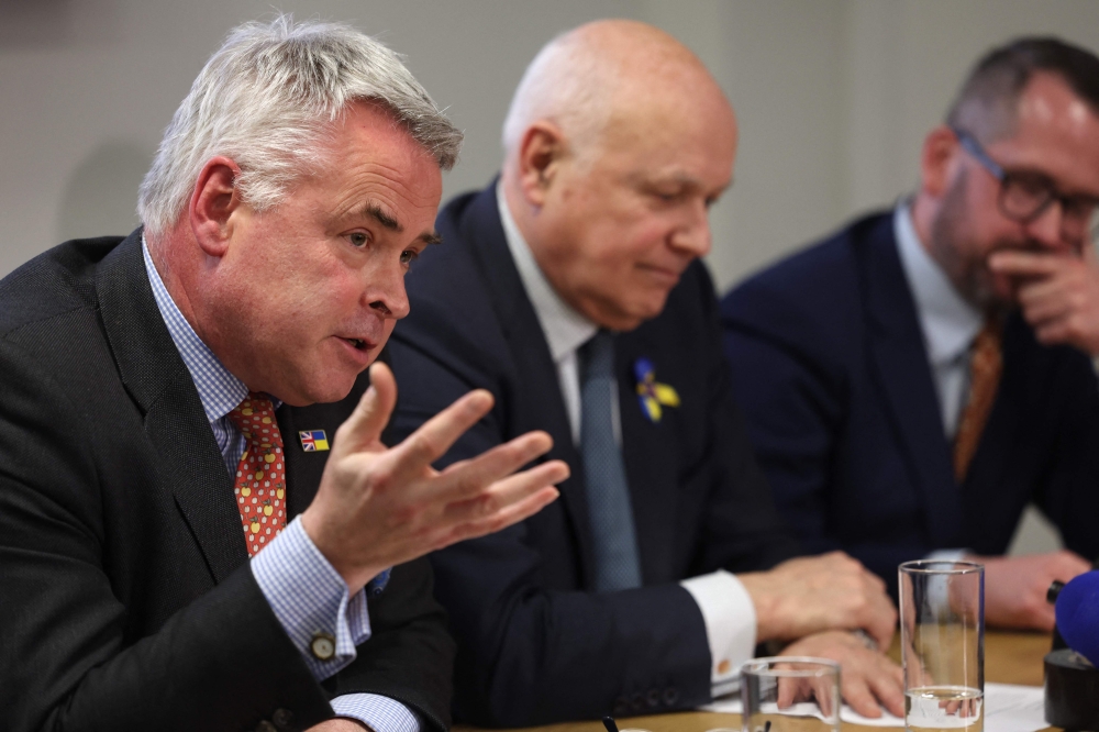 Conservative MP Tim Loughton, former Conservative leader, Iain Duncan Smith and SNP痴 former defense spokesman Stewart McDonald from the Inter-Parliamentary Alliance on China, hold a press conference in central London on March 25, 2024. Photo by Daniel LEAL / AFP.
