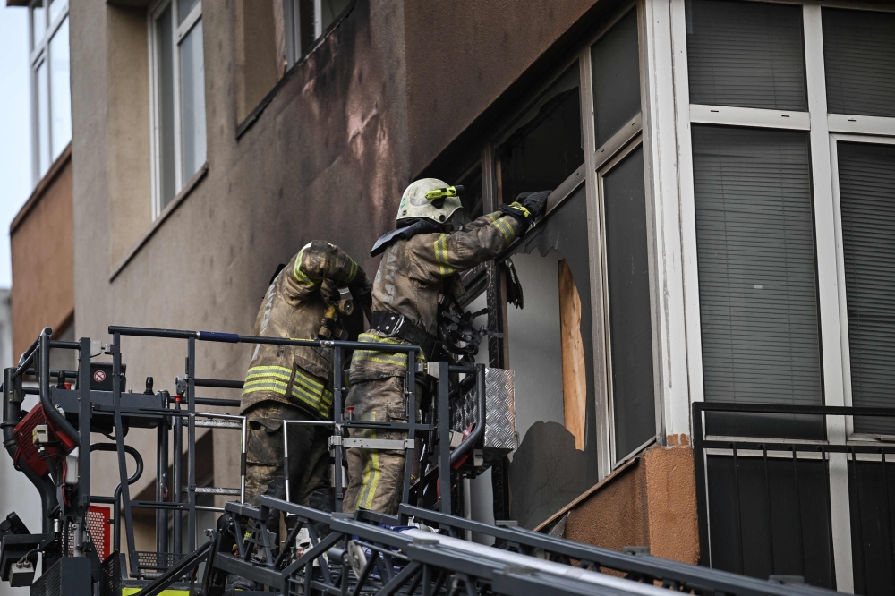 Firefighters intervene at the site of a fire in a residential building in Istanbul on April 2, 2024. Photo by OZAN KOSE / AFP