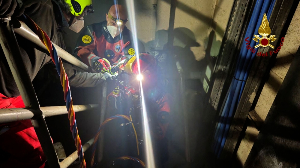 This photo taken and handout on April 10, 2024 by the Vigili del Fuoco, the Italian Corps. of Firefighters, shows firemen working on the site of an explosion at a hydroelectric power plant Enel Green Power on Lake Suviana in central Italy, near Bologna. (Photo by Handout / Vigili del Fuoco / AFP) 