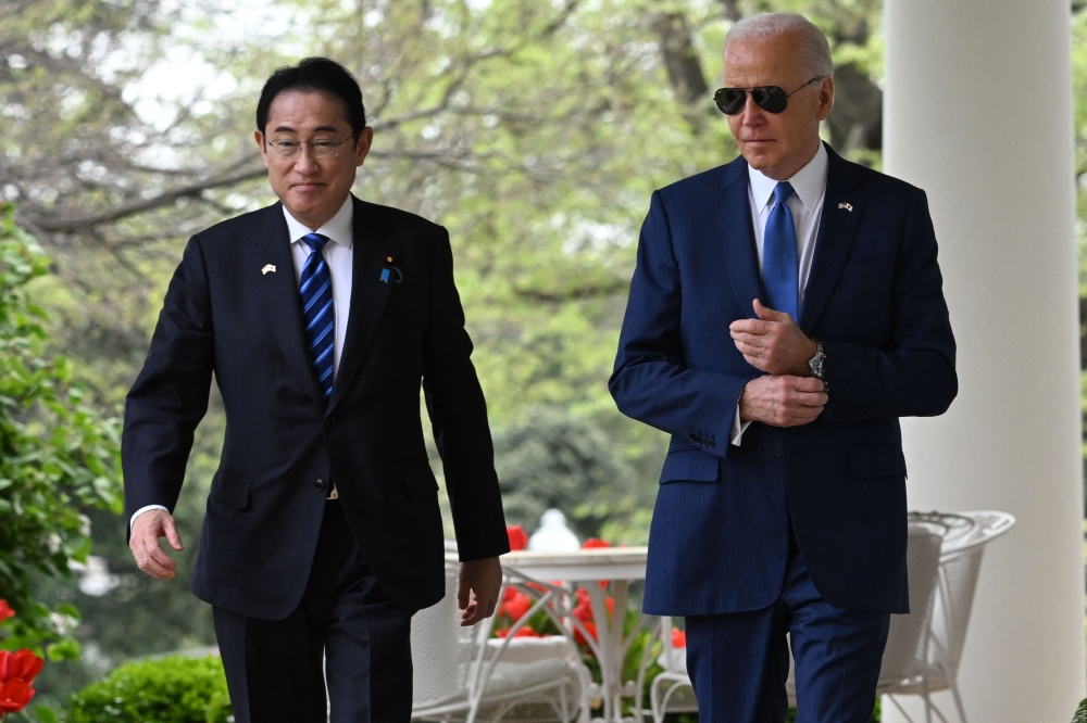 US President Joe Biden and Japanese Prime Minister Fumio Kishida arrive for a joint press conference in the Rose Garden of the White House in Washington, DC, April 10, 2024. (Photo by Saul Loeb / AFP)