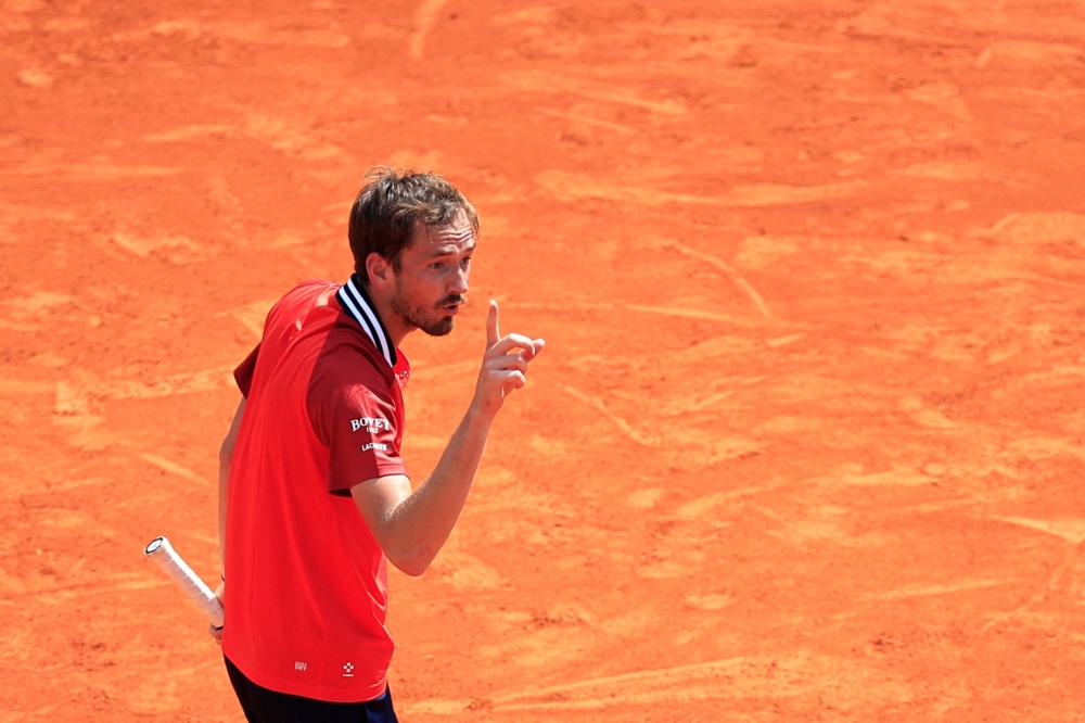 Russia's Daniil Medvedev reacts as he plays against Russia's Karen Khachanov during their Monte Carlo ATP Masters Series Tournament round of 16 tennis match on the Rainier III court at the Monte Carlo Country Club on April 11, 2024. (Photo by Valery HACHE / AFP)