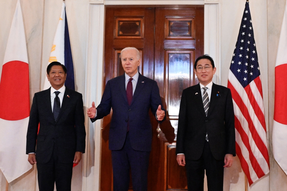 US President Joe Biden speaks to the press with Japanese Prime Minister Fumio Kishida (R) and Filipino President Ferdinand Marcos Jr. (L) at the White House in Washington, DC, April 11, 2024. (Photo by Andrew Caballero-Reynold / AFP)

