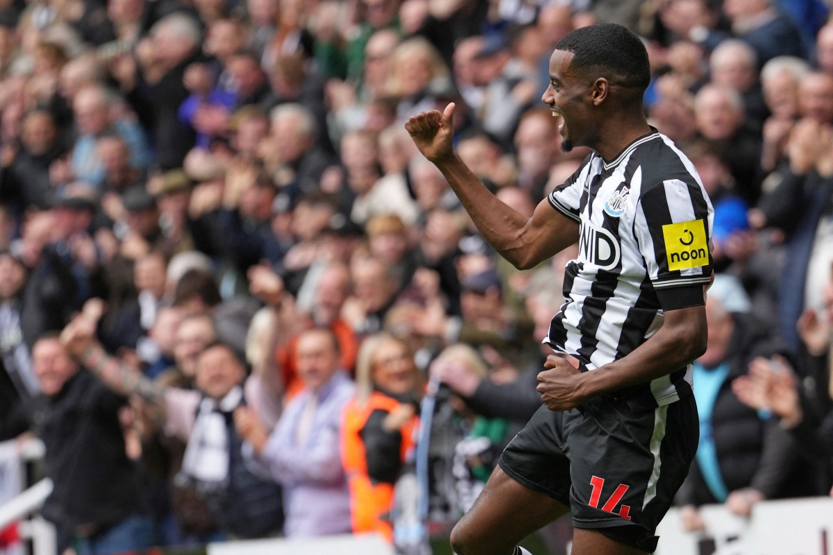 Newcastle United's Swedish striker #14 Alexander Isak celebrates after scoring their third goal during the English Premier League football match between Newcastle United and Tottenham Hotspur at St James' Park in Newcastle-upon-Tyne, north east England on April 13, 2024. (Photo by Andy Buchanan / AFP) 