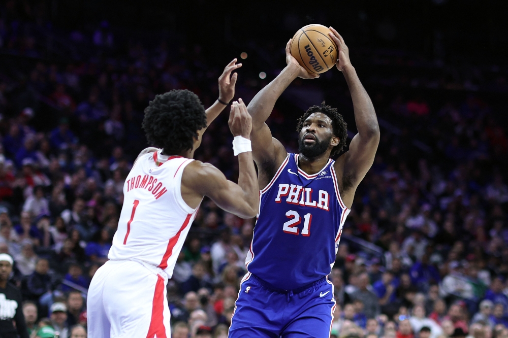 Joel Embiid #21 of the Philadelphia 76ers shoots over Amen Thompson #1 of the Houston Rockets during the fourth quarter at the Wells Fargo Center on January 15, 2024 in Philadelphia, Pennsylvania. Tim Nwachukwu/Getty Images/AFP

