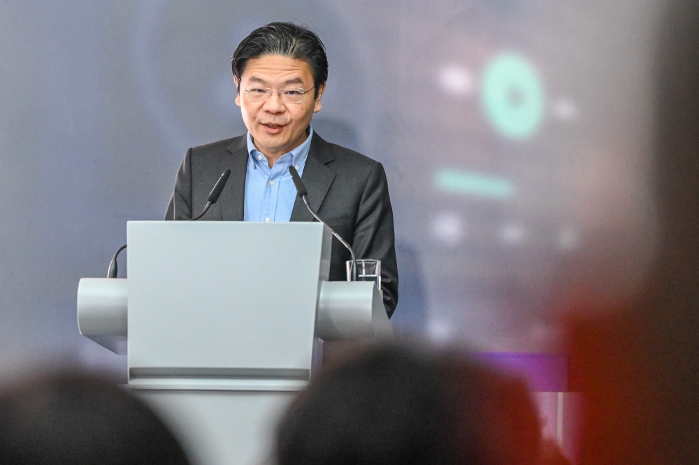 (Files) Singapore's Deputy Prime Minister and Minister for Finance Lawrence Wong during the Singapore Fab expansion grand opening in Singapore on September 12, 2023. (Photo by Roslan Rahman / AFP)