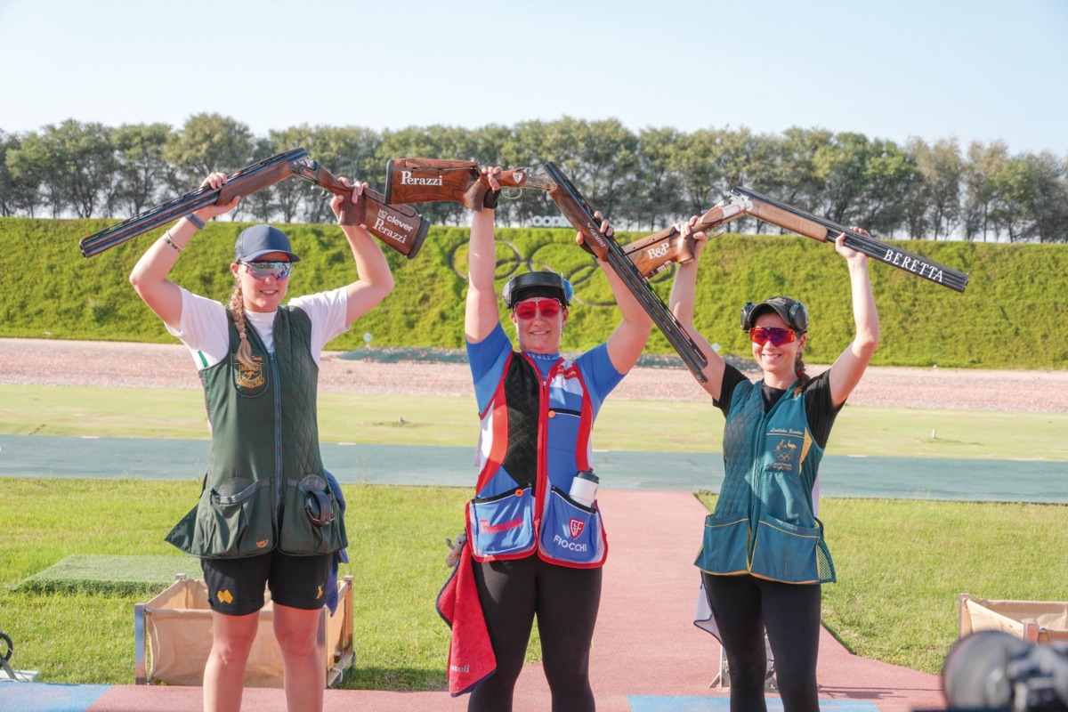 Slovakia’s Zuzana Stefecekova (centre) celebrates after winning the Final Olympic Qualification Shotgun Championship at the Lusail Shooting Complex yesterday. Australia’s Laetisha Scanlan (left) finished second while her compatriot Penny Smith was third.