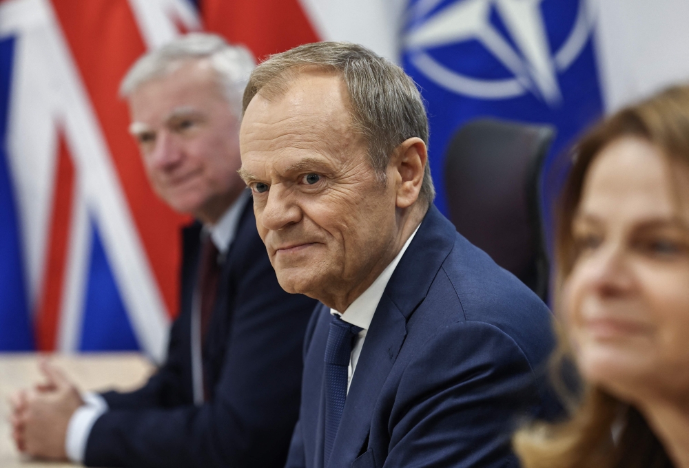 Polish Prime Minister Donald Tusk looks on prior trilateral talks with the NATO Secretary General and Britain's Prime Minister at the Warsaw Armoured Brigade in Warsaw, Poland, on April 23, 2024. (Photo by HENRY NICHOLLS / AFP)
