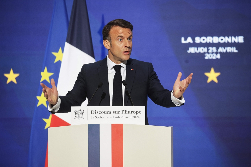 French President Emmanuel Macron delivers a speech on Europe in an amphitheatre of the Sorbonne University in Paris, on April 25, 2024. (Photo by Christophe Petit Tesson / POOL / AFP)
